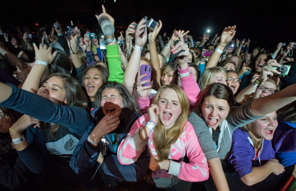 Anonymous. Justin Bieber fans at a concert.