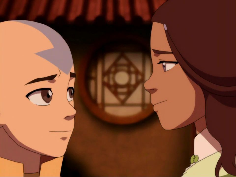 Aang and Katara gaze back at one another right before they share their first real kiss. 