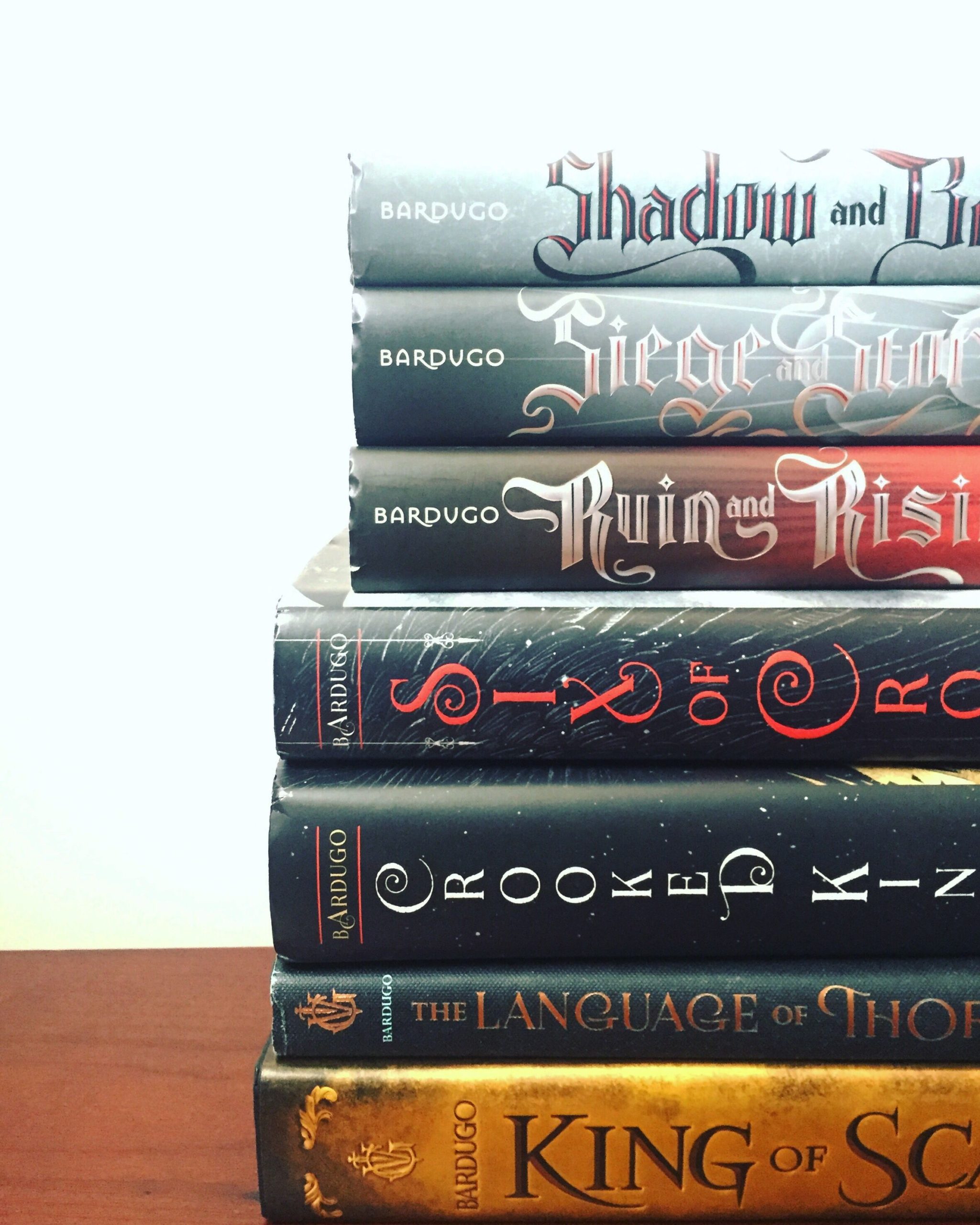 A photo shows a stack of books by author Leigh Bardugo. "Thebookcovergirls." Leigh Bardugo Novels. 2019.