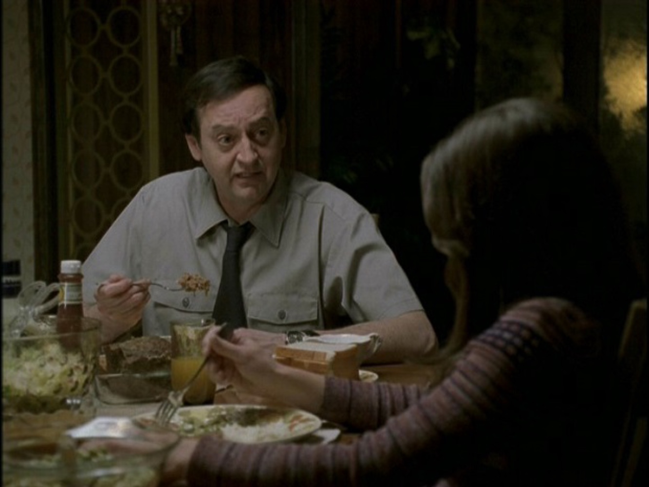 The Weirs having one of many onscreen family dinners, with Mr. Weir going on one of his infamous rants.