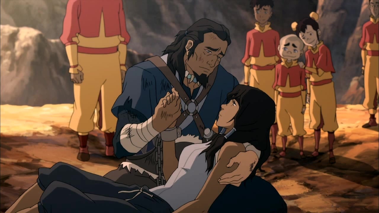 Korra's father holds her after the final battle with Zaheer. 