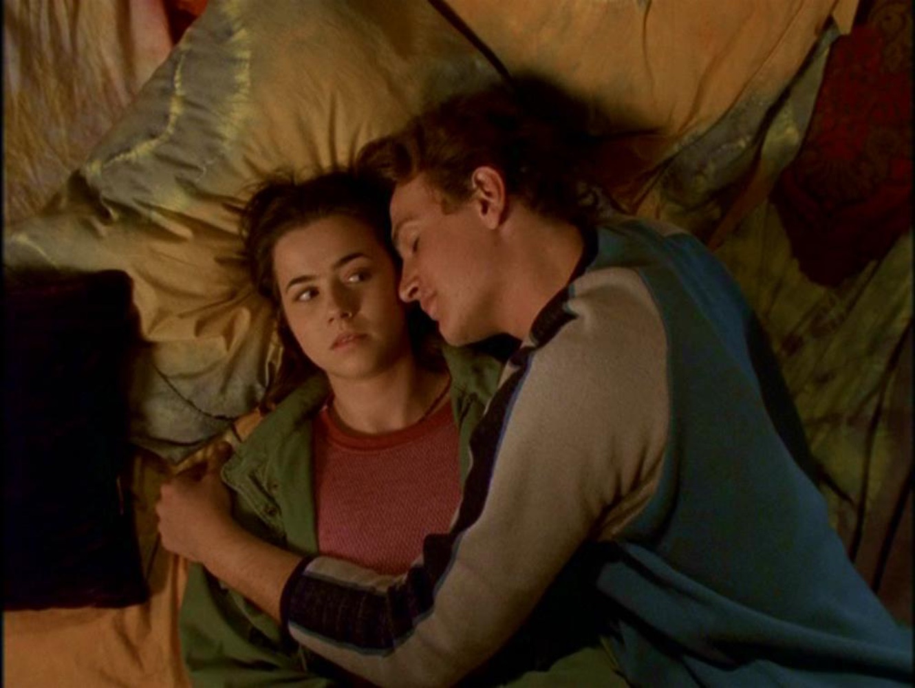 Nick cuddling Lindsay as she considers whether she's happy in a relationship.