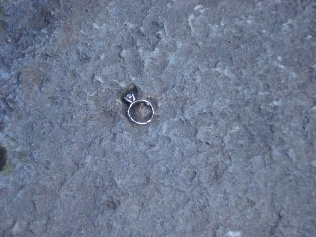 Theme Parks: A diamond engagement ring buried in the cement outside of The Haunted Mansion in the Magic Kingdom. 