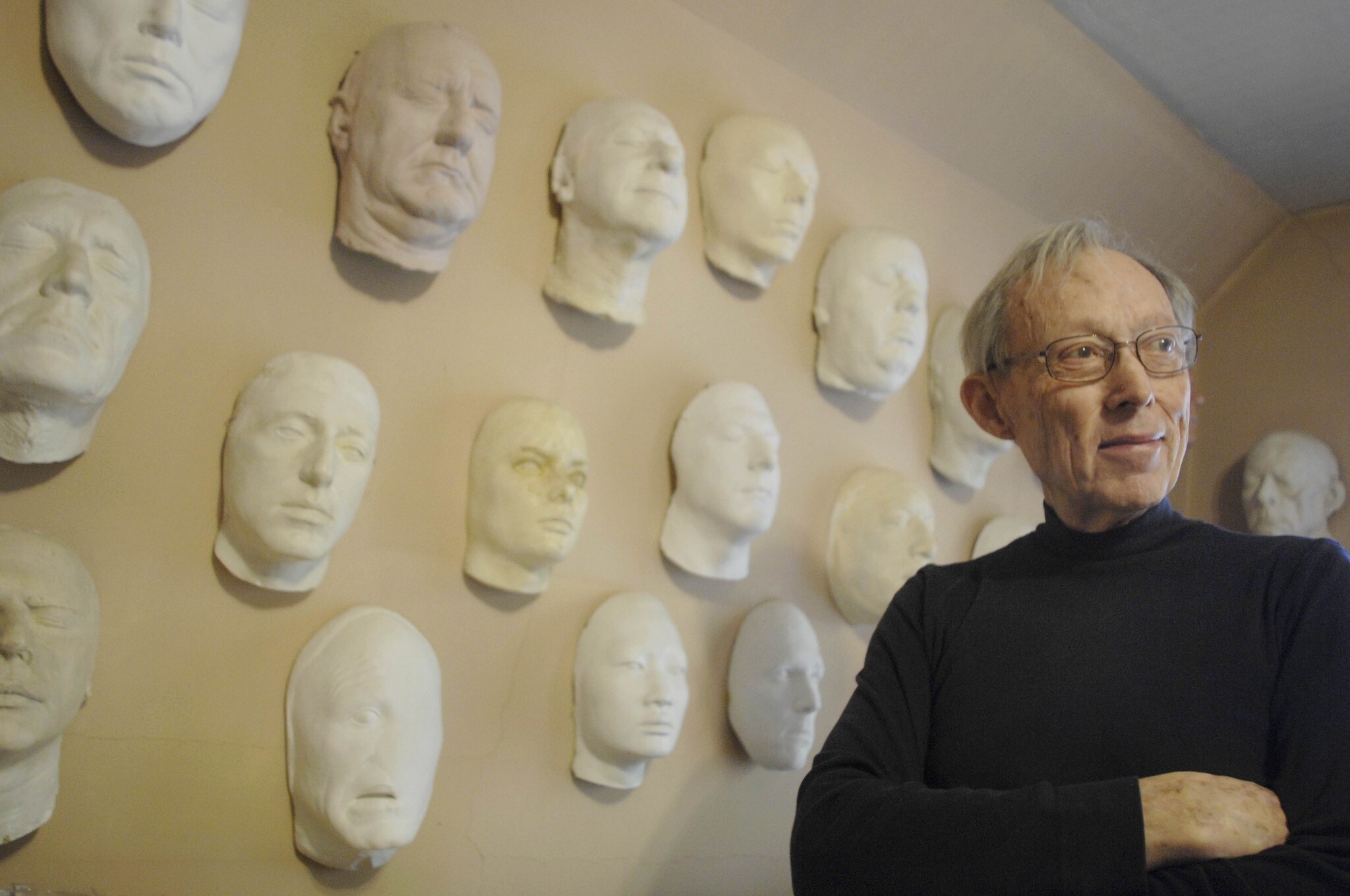 Dick Smith poses in front of his many face casts (used to create the horror villains in his work) for 'The Washington Post' in 2007.