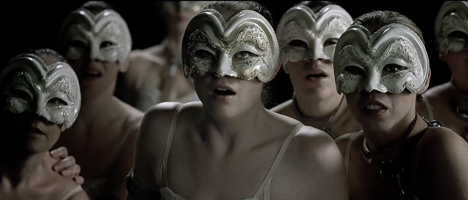 Ballerinas wearing silver masks in the film adaptation of "Harrison Bergeron," "2081."