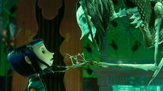 Coraline (2009) looks down in horror as the other mother taunts her for attempting to escape the other-world. 