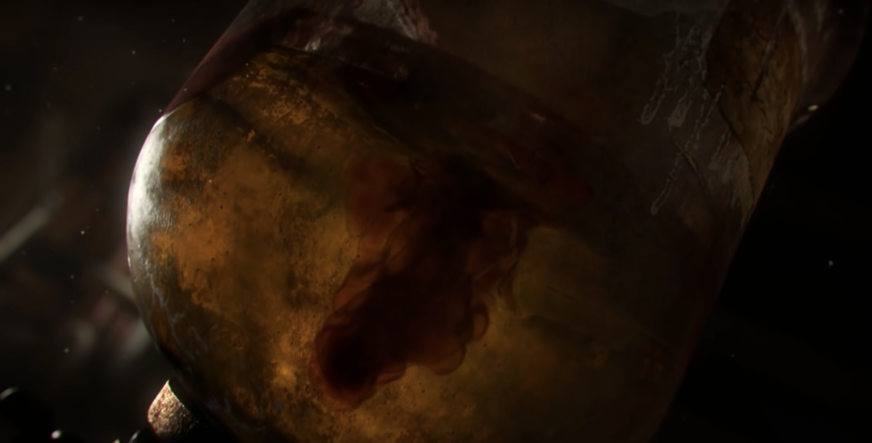 An image of a grungy glass IV container during FromSoftware's "Bloodborne's" blood ministration process. A drop of blood falls into a straw-colored liquid. (Photo by FromSoftware)