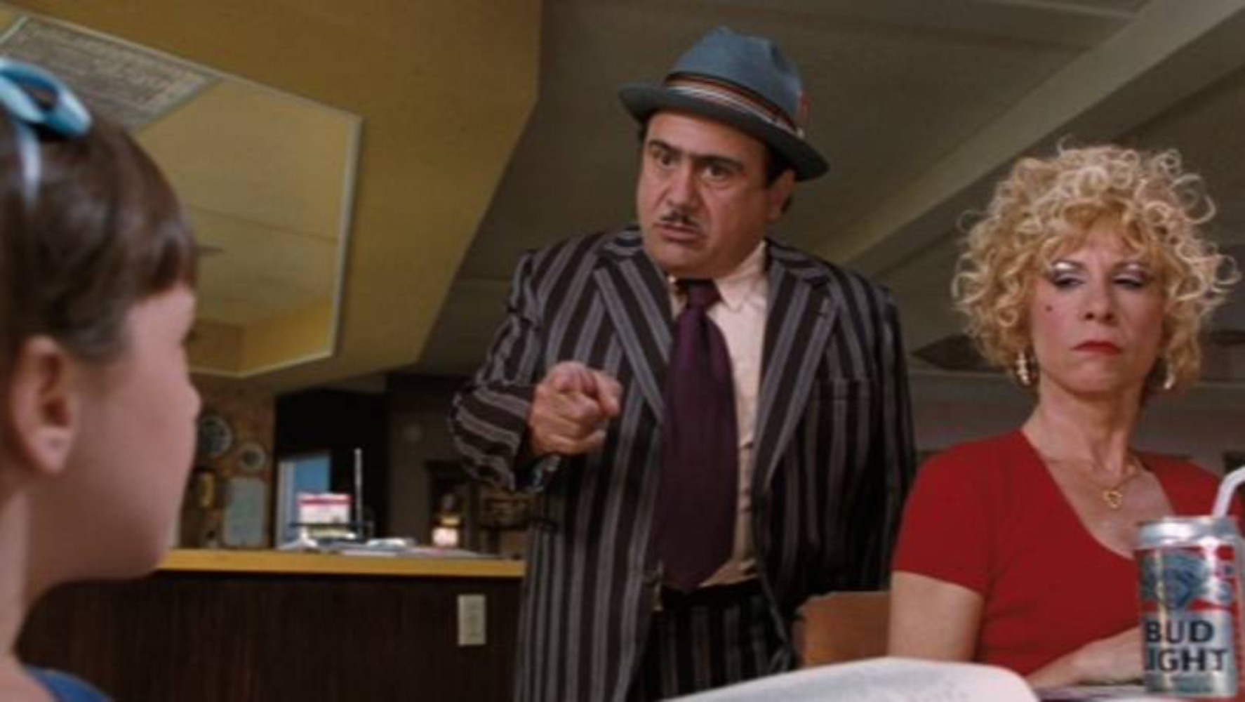 A still from the Matilda film where Mr. Wormwood scolds Matilda for being "smart" with him.