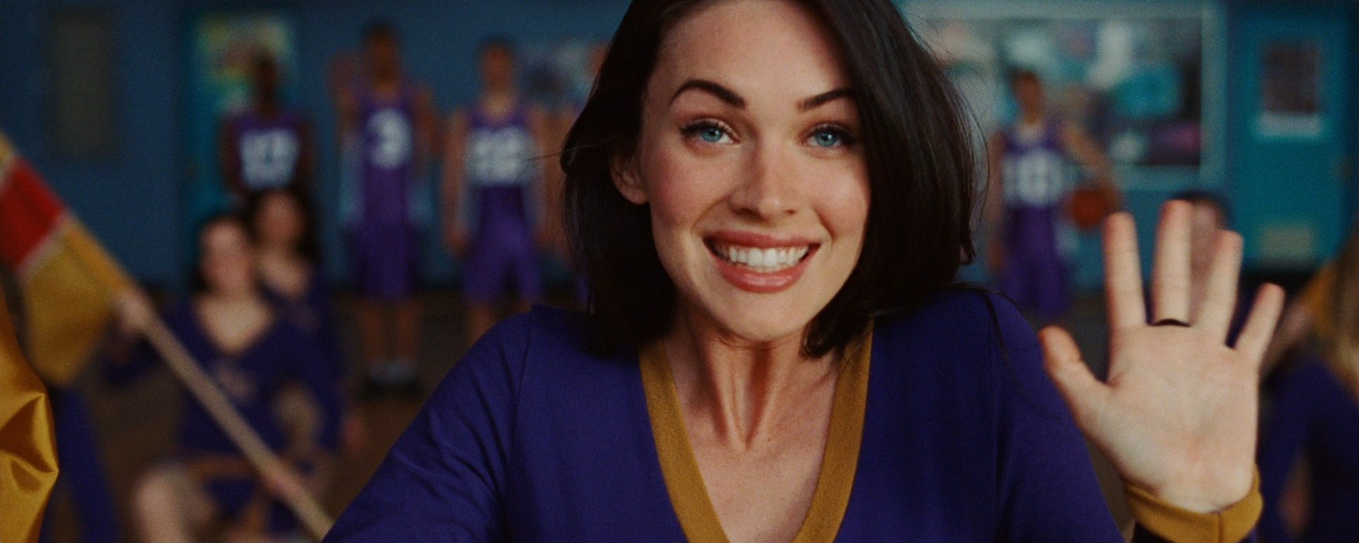 Jennifer Check, at a pep rally, waves to Needy in the one scene that she wears her cheerleading uniform, in 'Jennifer's Body' (2009).