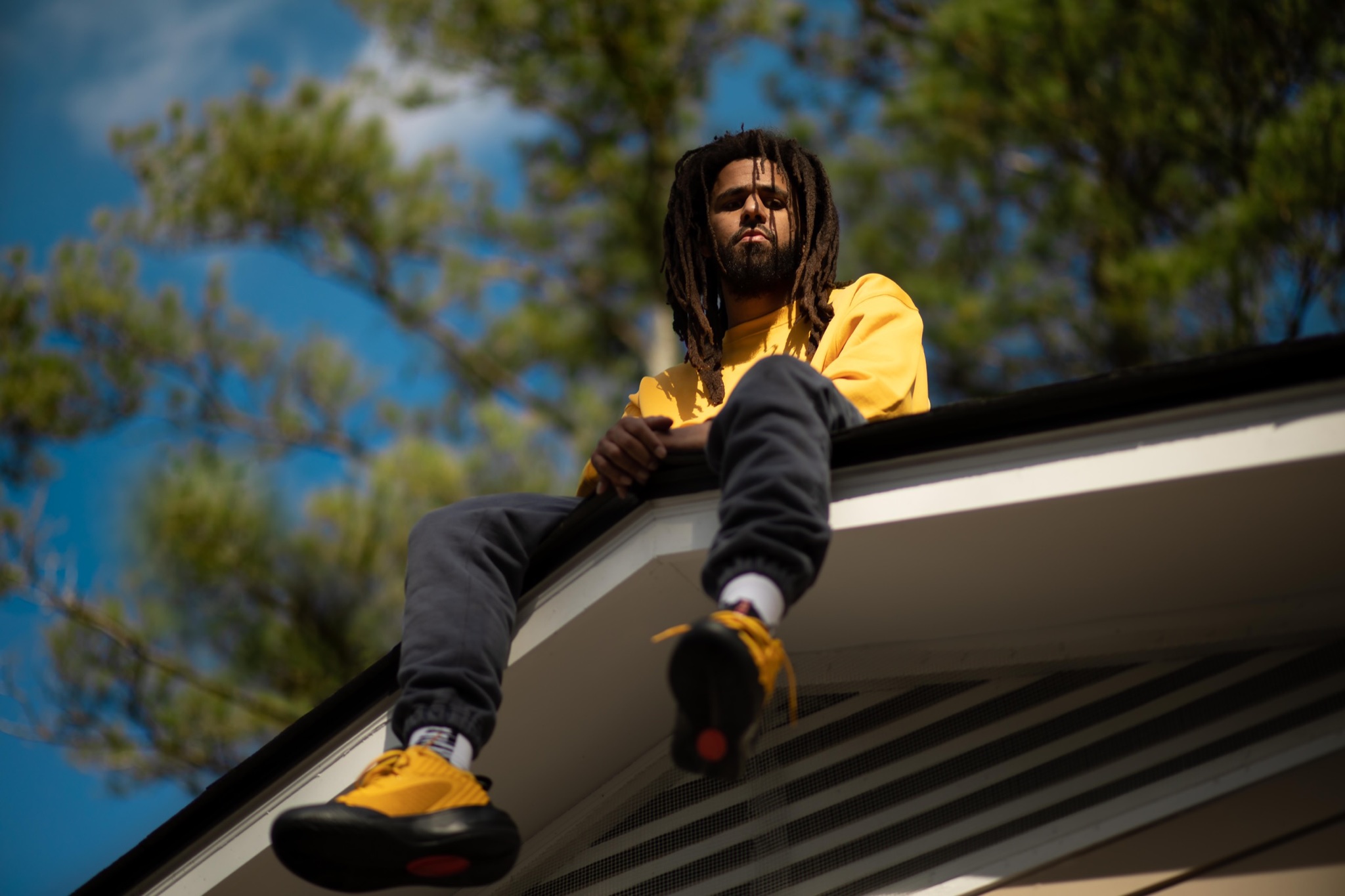 Rhyme: J. Cole sits on roof, mirroring the cover of his 2014 LP "2014 Forest Hills Drive."