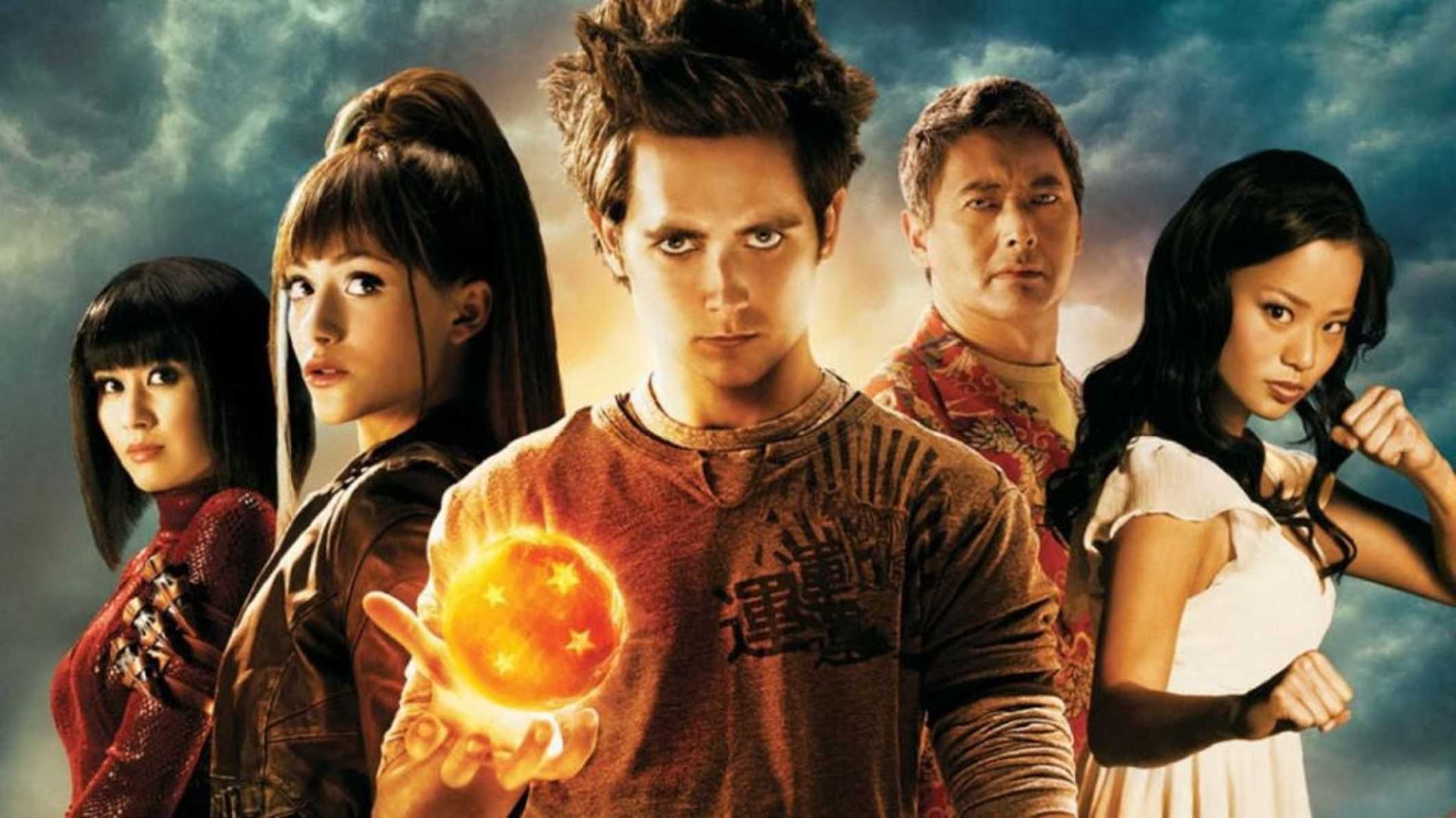 The promotional image for Dragonball Evolution. Five people stand against a cloudy background, the front most holding a glowing orange Dragon Ball (a round object with four stars inside) in his palm.