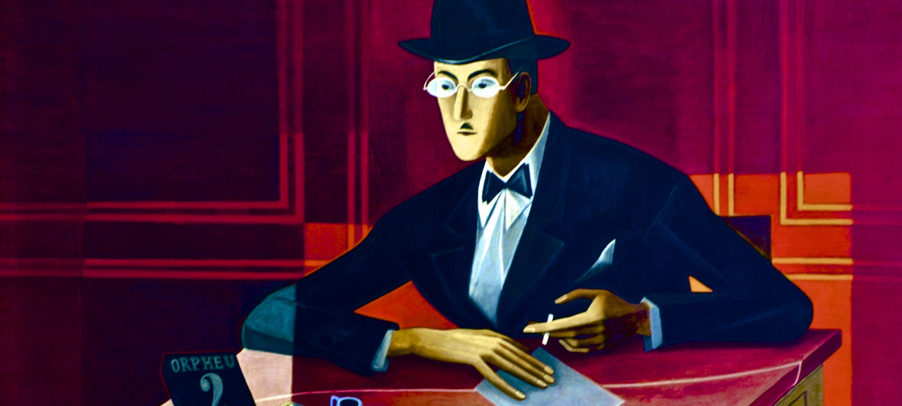 A portrait of Fernando Pessoa painted by Almada Negreiros. Features Pessoa in a suit and bow tie, writing with pen on paper. Behind him is a red background.