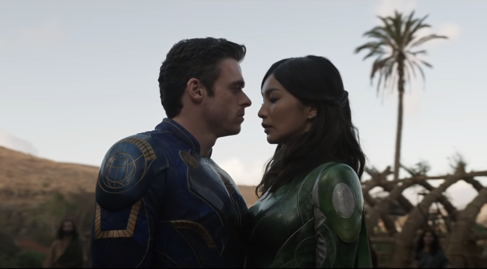 Richard Madden's Ikaris and Gemma Chan's Sersi embrace in 'Eternals' (2021).