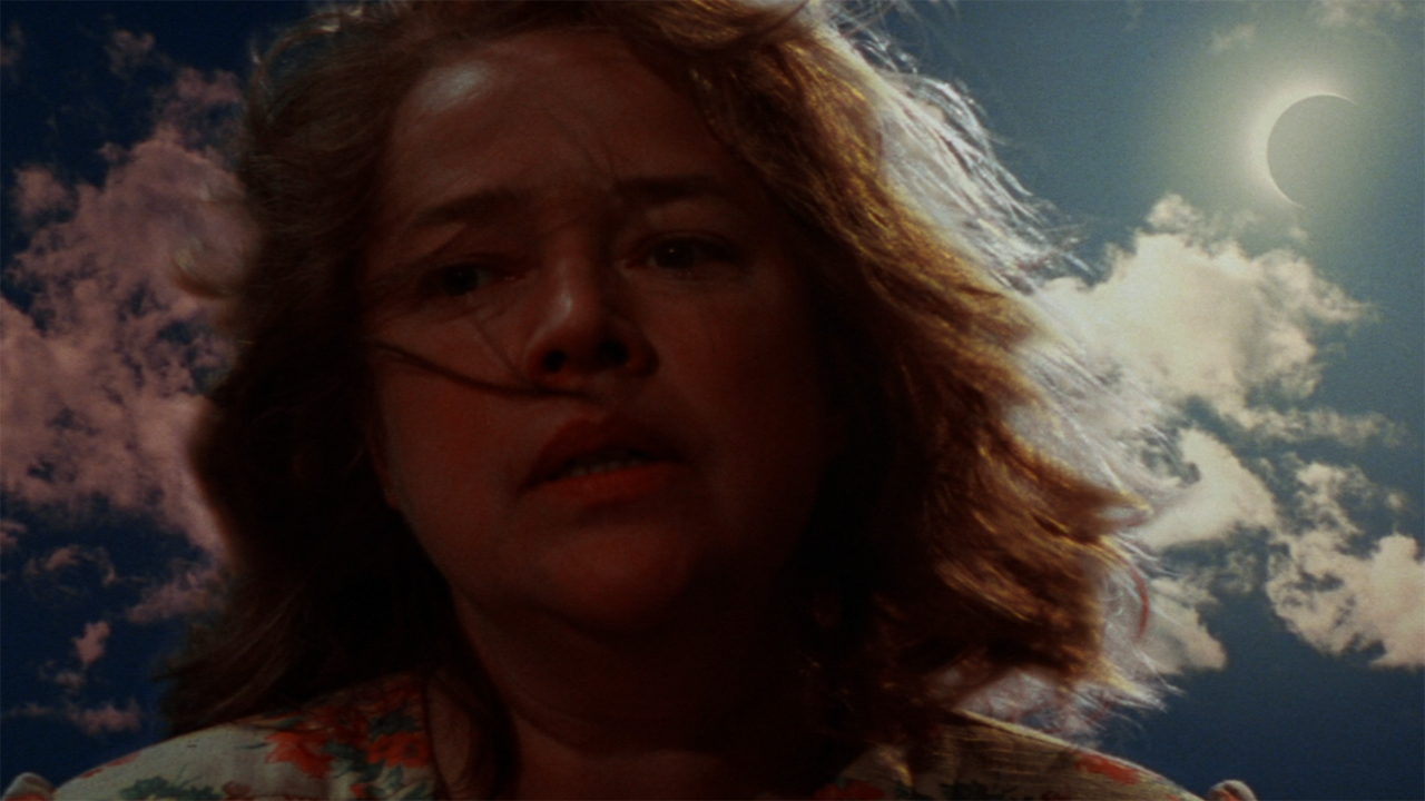 Dolores (Kathy Bates) looks down the well after Joe's accident during the solar eclipse, 1995. (Photo by Sony Pictures Releasing) 