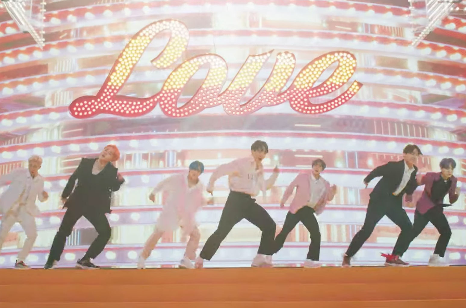 BTS dance in music video for "Boy With Luv." 