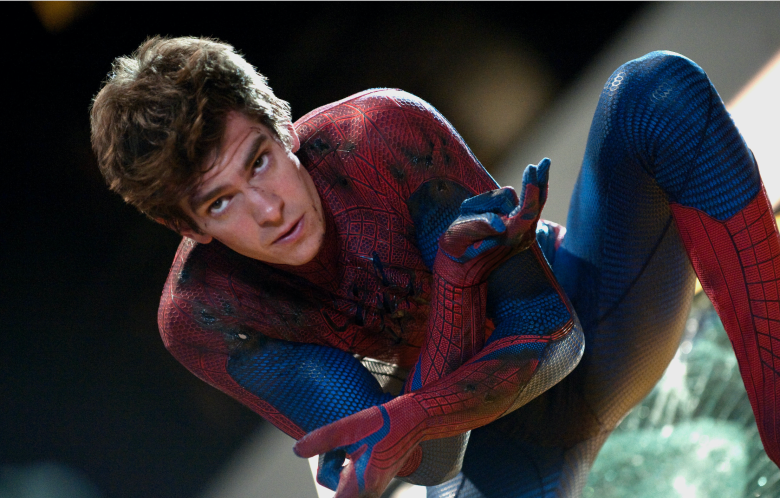 Andrew Garfield as Spider-Man, poses with webslingers prepared. 