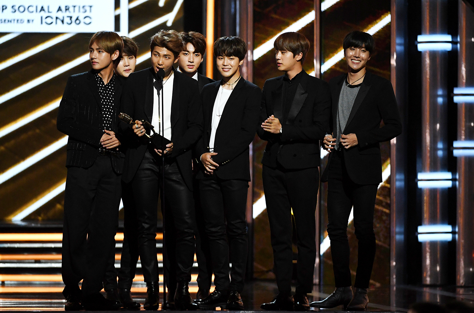 BTS accept the award for Top Social Artist. 