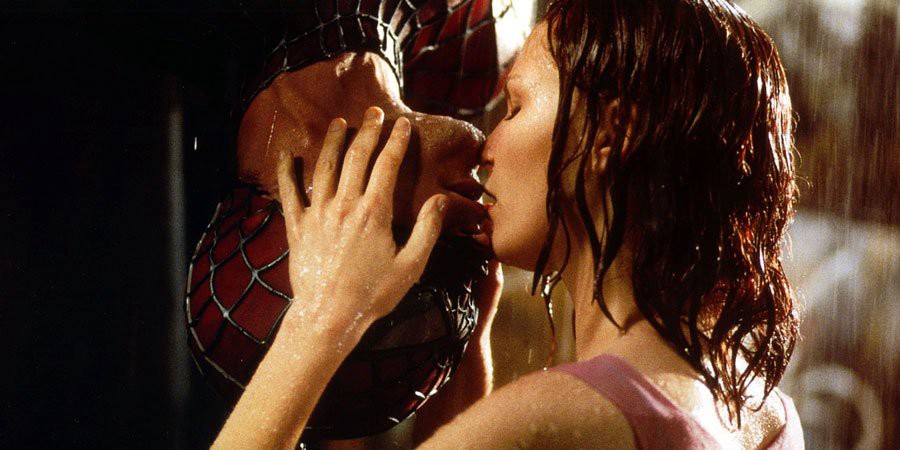 Spider-Man (Maguire) and Mary Jane lock in an iconic upside down kiss. 
