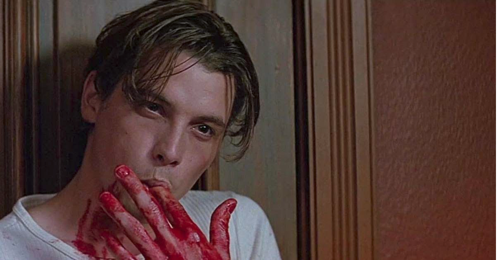 Billy Loomis licks the fake blood off his fingers as he reveals his true nature to Sidney in 'Scream.'