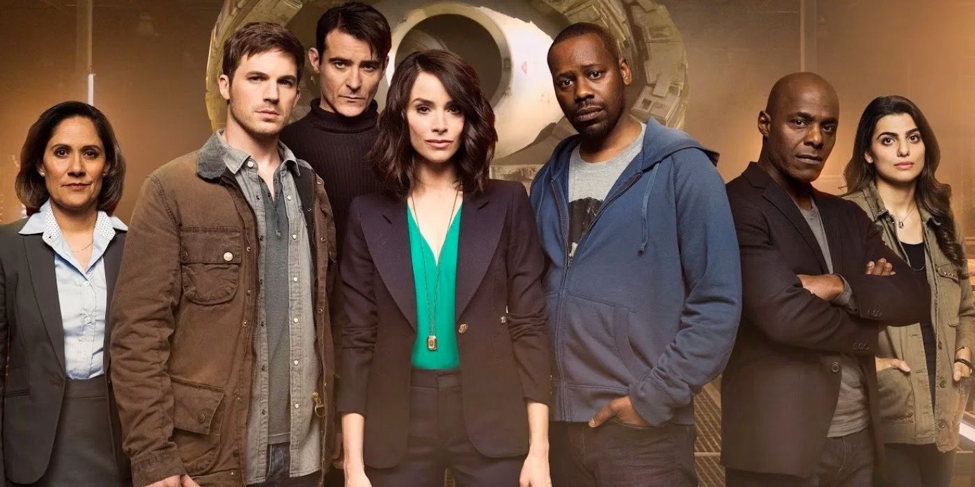 A photo showing the cast of Timeless. There is a time machine in the background. From left to right, the cast is Denise Christopher (Sakina Jaffrey), Wyatt Logan (Matt Lanter), Garcia Flynn (Goran Višnjić), Lucy Preston (Abigail Spencer), Rufus Carlin (Malcolm Barrett), Connor Mason (Paterson Joseph), and Jiya Marri (Claudia Doumit). 