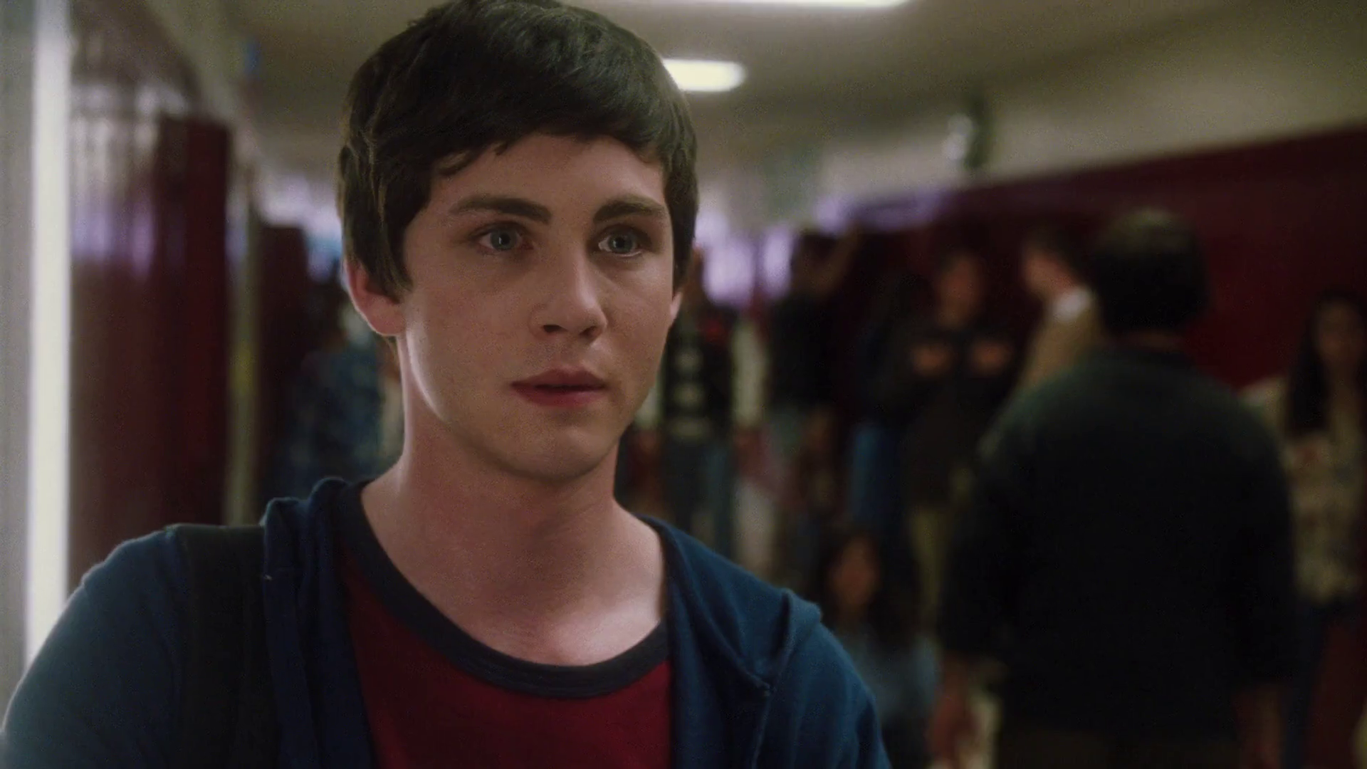 Charlie, timidly, walks the halls of highschool in 'The Perks of Being A Wallflower' (2012).