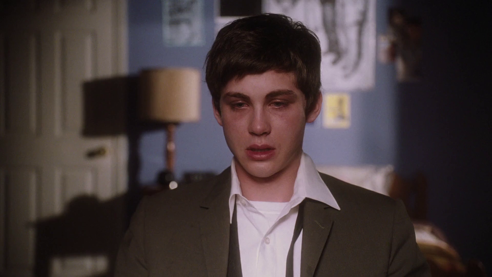 Charlie cries at his desk in the final montage scene of his breakdown in 'The Perks of Being a Wallflower' (2012).