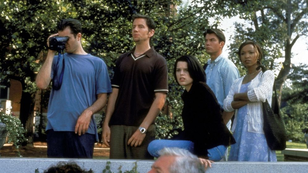 Sidney and her college friends look on as reporters swarm their campus.