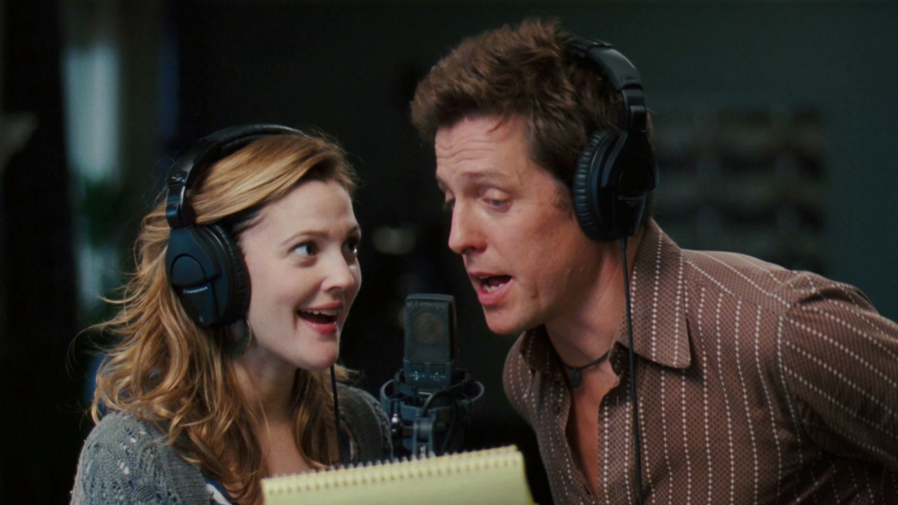 Drew Barrymore as Sophie Fisher and Hugh Grant as Alex Fletcher recording "A Way Back Into Love" in Music and Lyrics (2007).