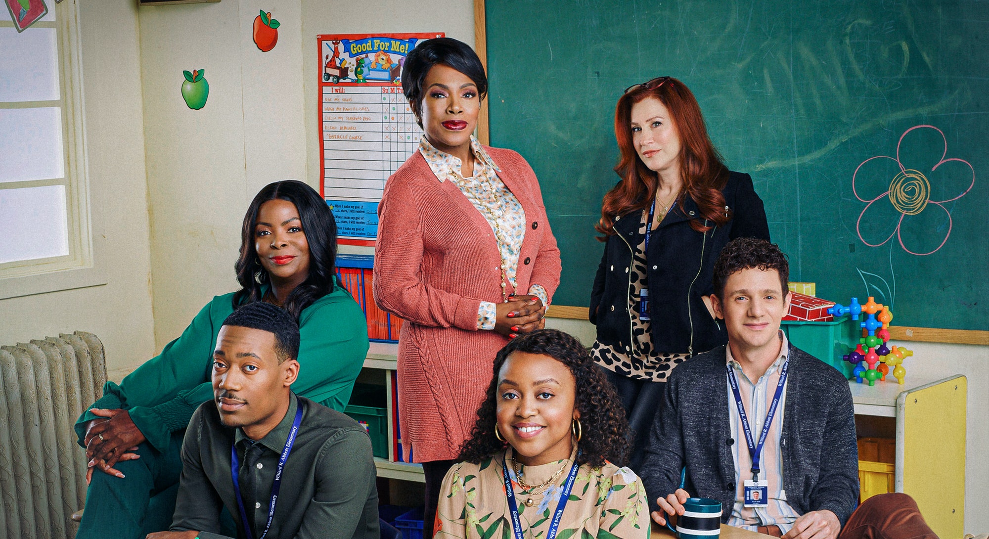 The leads of 'Abbott Elementary' are posing together in a classroom.