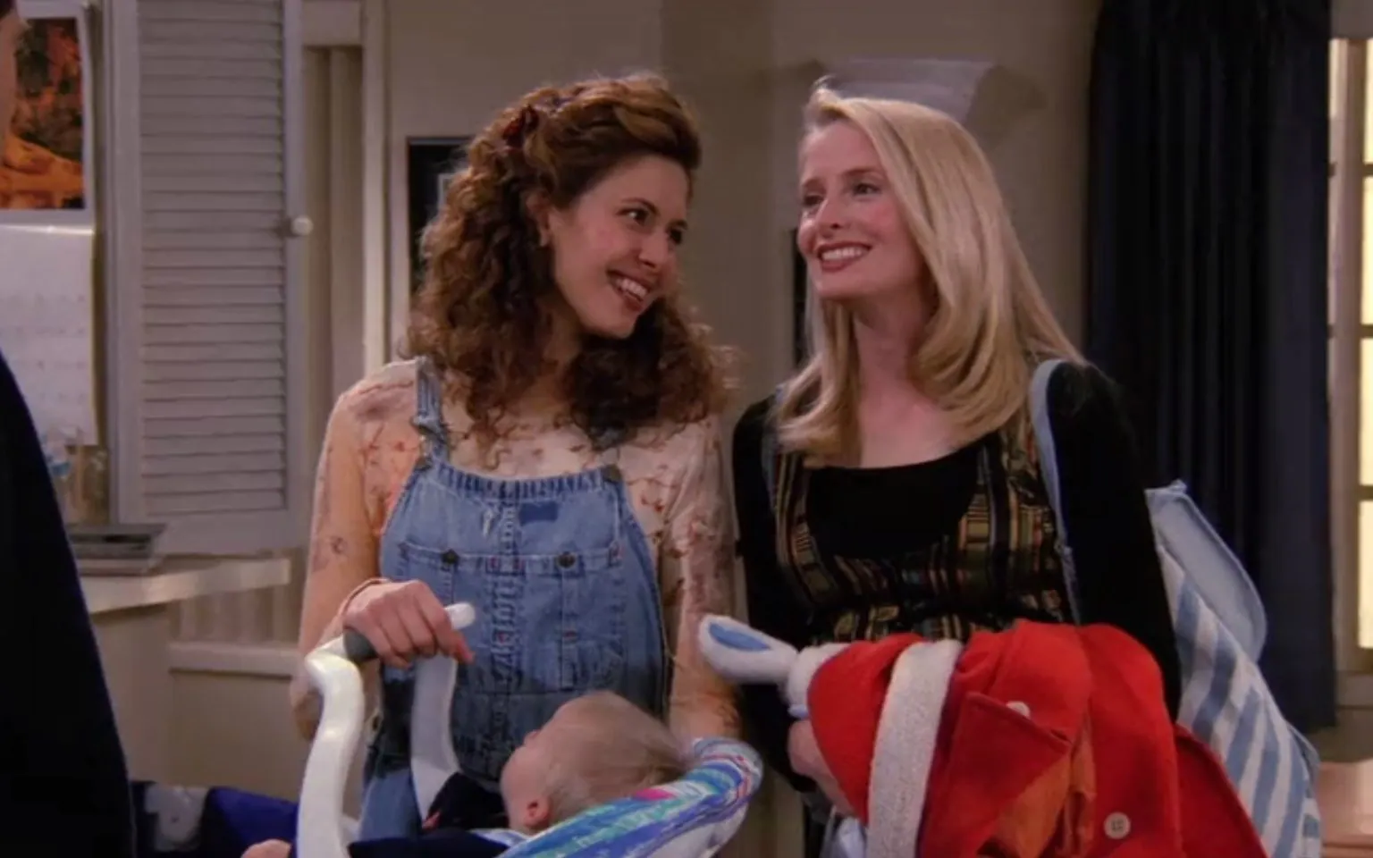 Susan (Jessica Hecht) looks lovingly at her partner Carol (Jane Sibbett). Friends. 1994-2004. NBC