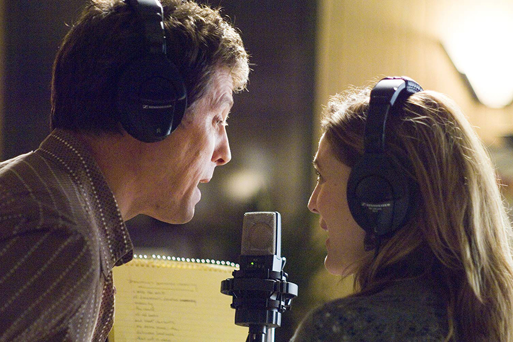 Drew Barrymore as Sophie Fisher and Hugh Grant as Alex Fletcher recording the demo of "A Way Back Into Love" together in Music and Lyrics (2007). 