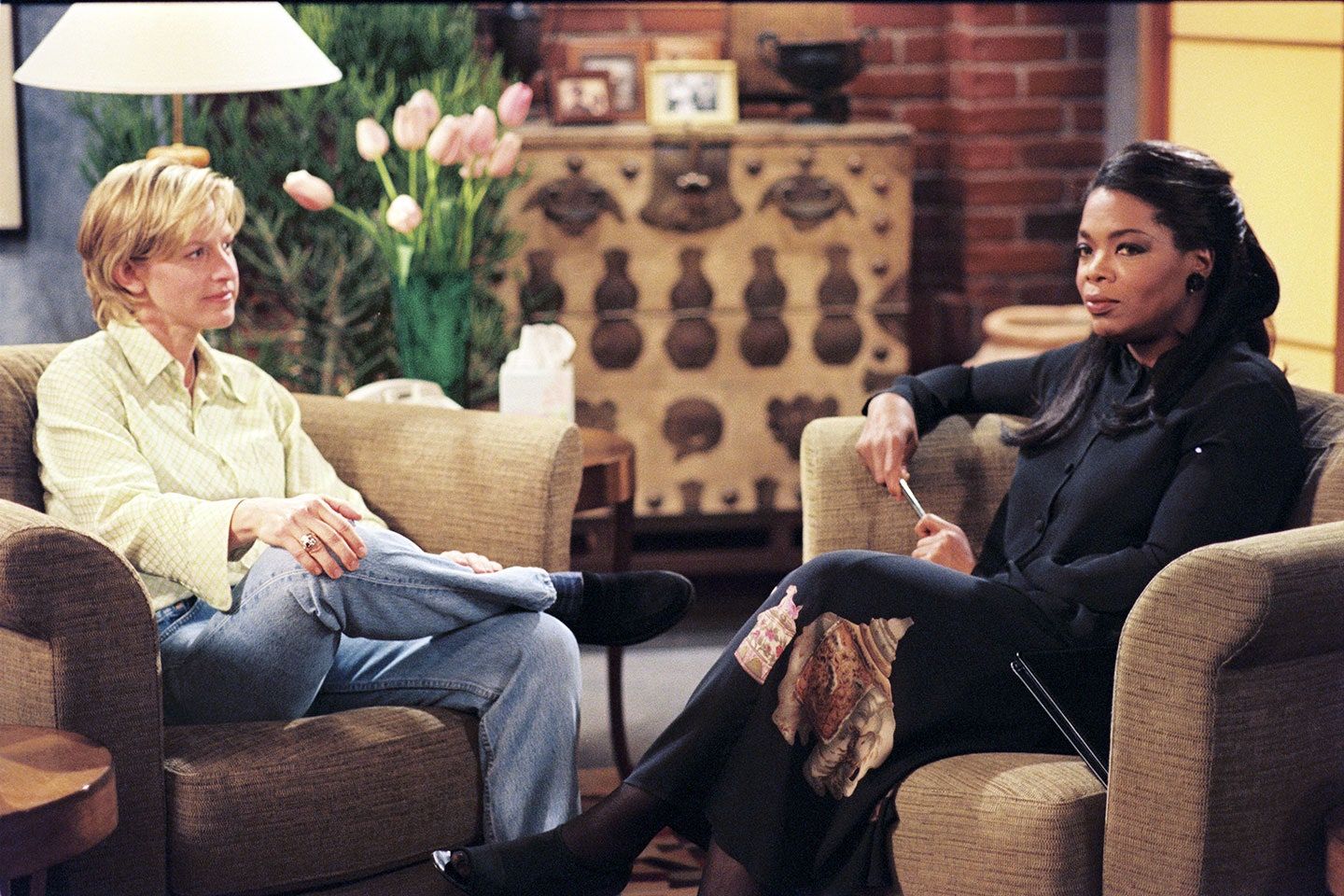 Ellen Morgan (Ellen DeGeneres) and her therapist (Oprah Winfrey) sit in arm chairs slightly angled toward each other. Ellen. 1994-1998. The American Broadcasting Company (ABC).