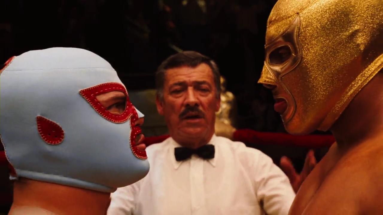 Jack Black as Nacho Libre facing off against  Silver King as Ramses in Nacho Libre (2006).