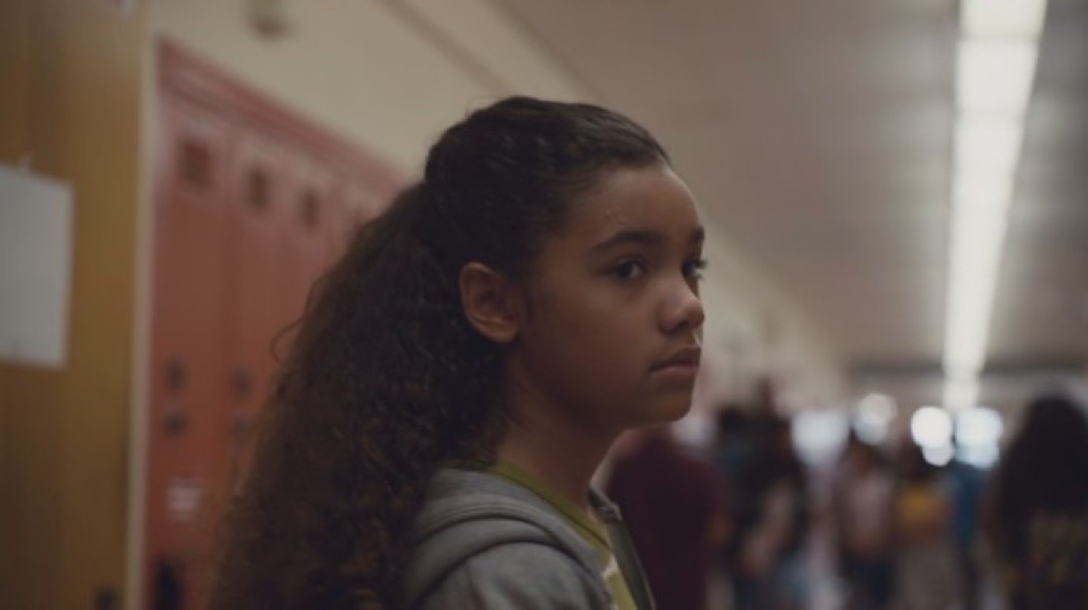 Rue is pictured as a child, in the school hallways, with an uneasy look on her face, most likely due to her severe anxiety in 'Euphoria' season one, episode one. 