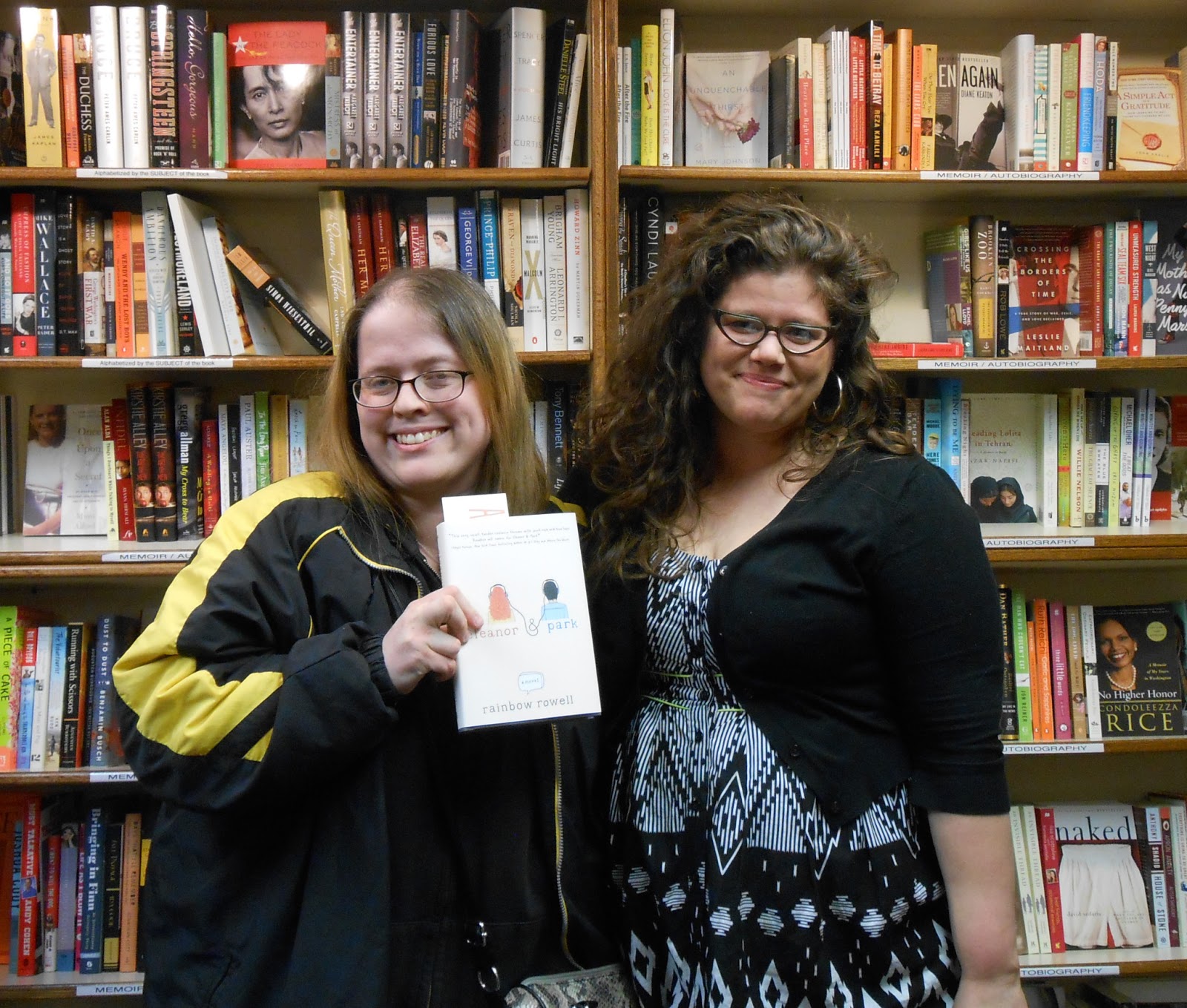 A picture of Becky B. holding up a copy of "Eleanor & Park" standing next to author Rainbow Rowell. 