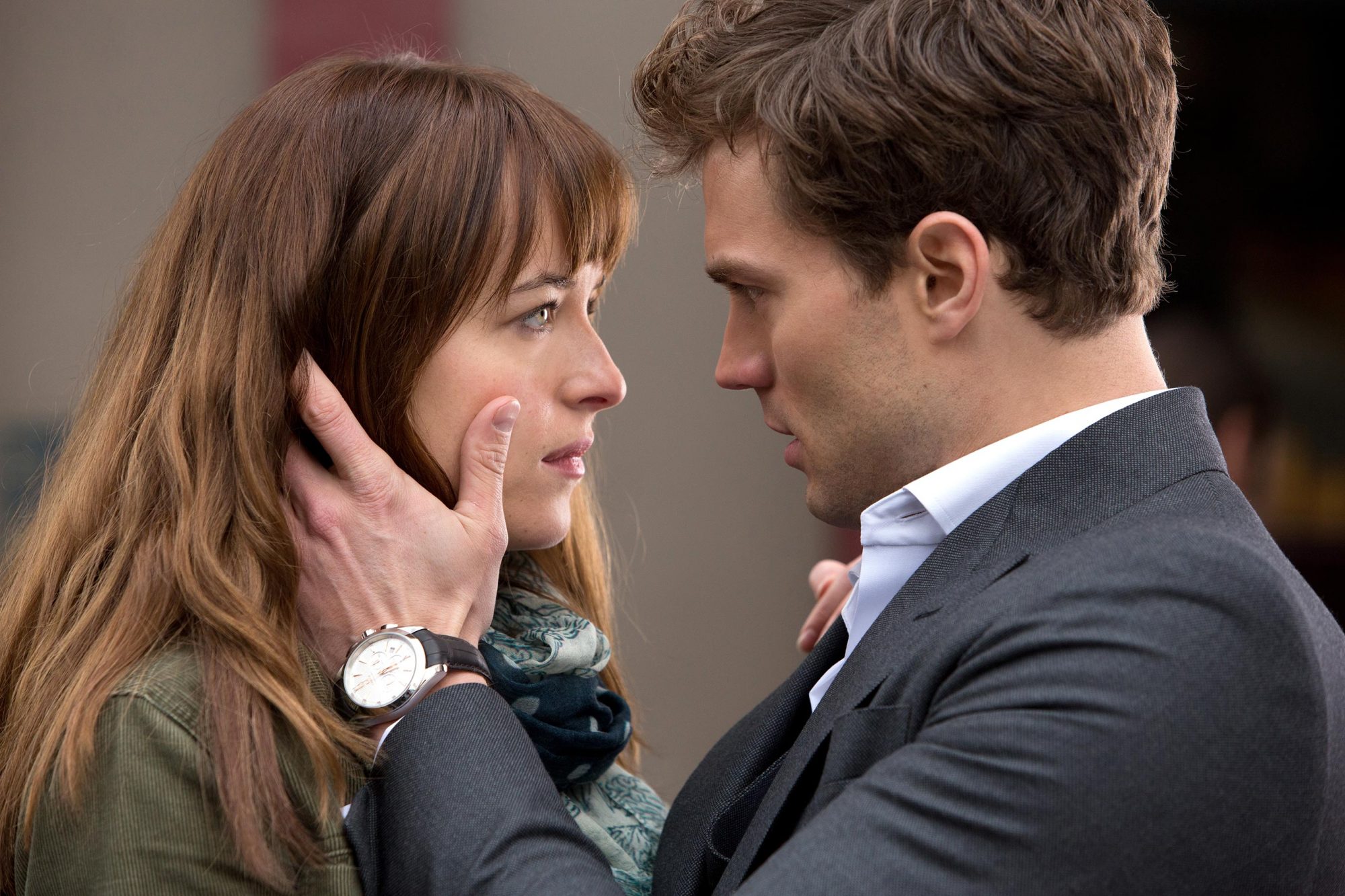 A screencap of Christian Grey caressing Anastasia Steele's face from "Fifty Shades of Grey."