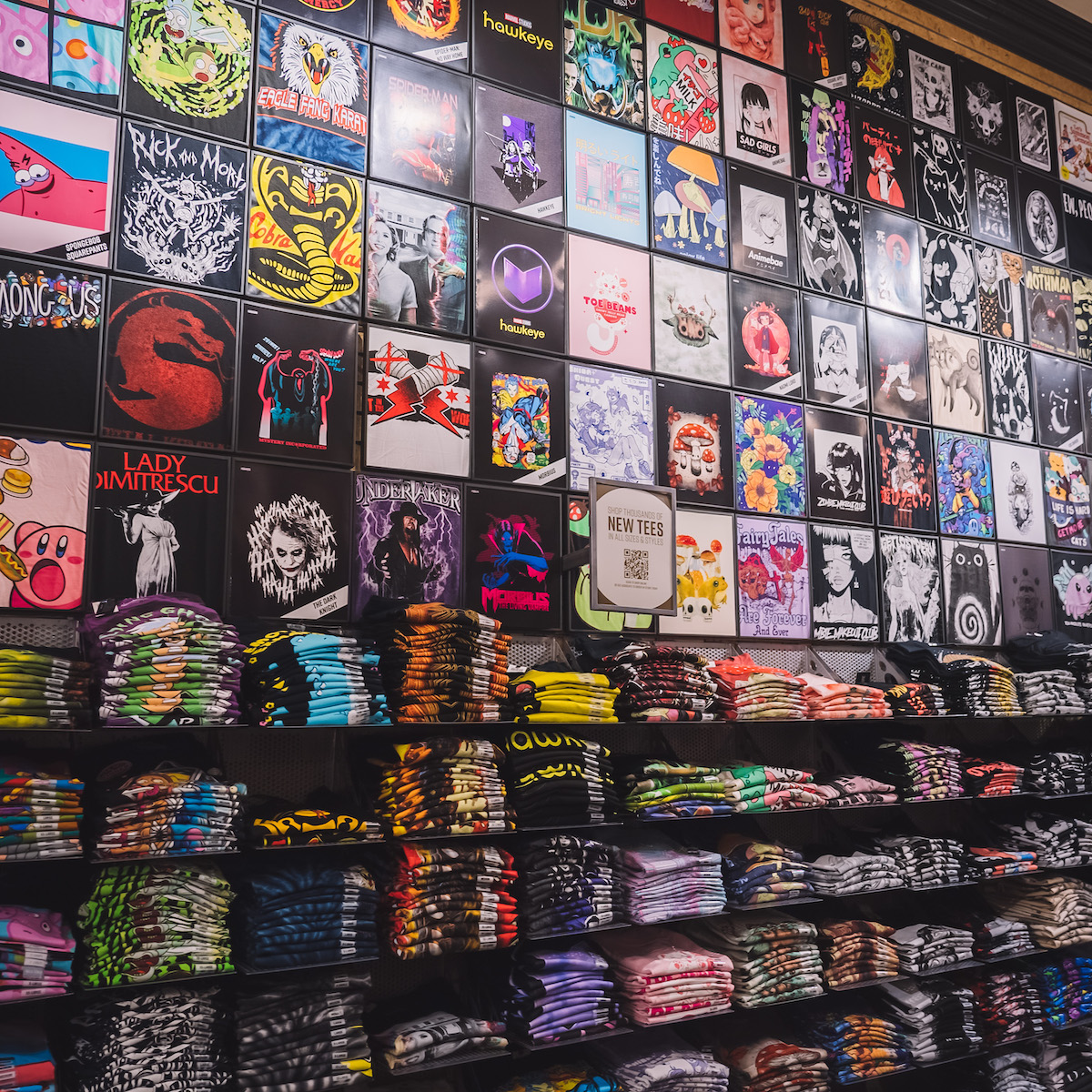 The shirt section inside of a Hot Topic, showing an array of different fandoms and designs. 