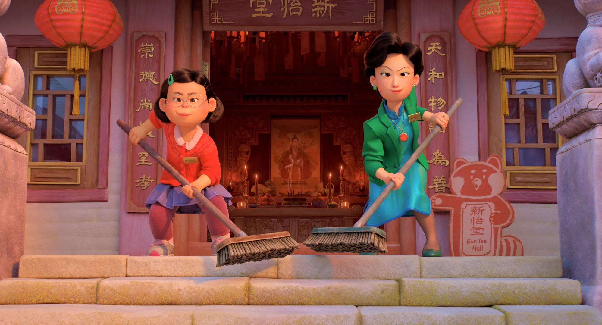 "Intergenerational Trauma:" Meilin (Rosalie Chiang) and Ming Lee (Sandra Oh) from Pixar's 'Turning Red' get ready to sweep their porch. 