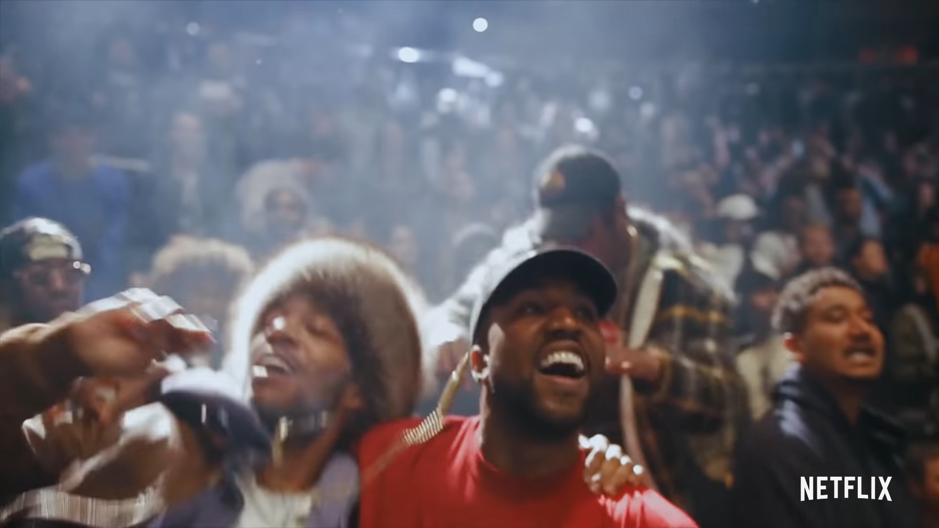 Kanye West alongside Kid Cudi embracing each other at Kanye West's listening party for "The Life of Pablo.".