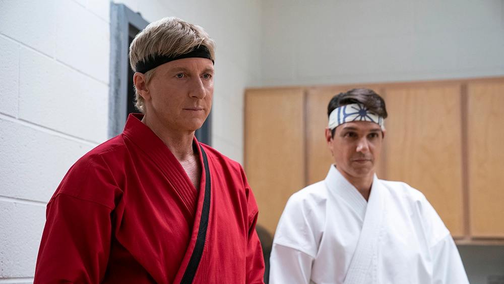 Johnny Lawrence (William Zabka) and Daniel LaRusso (Ralph Macchio) don Karate Gis in Netflix's "Cobra Kai"