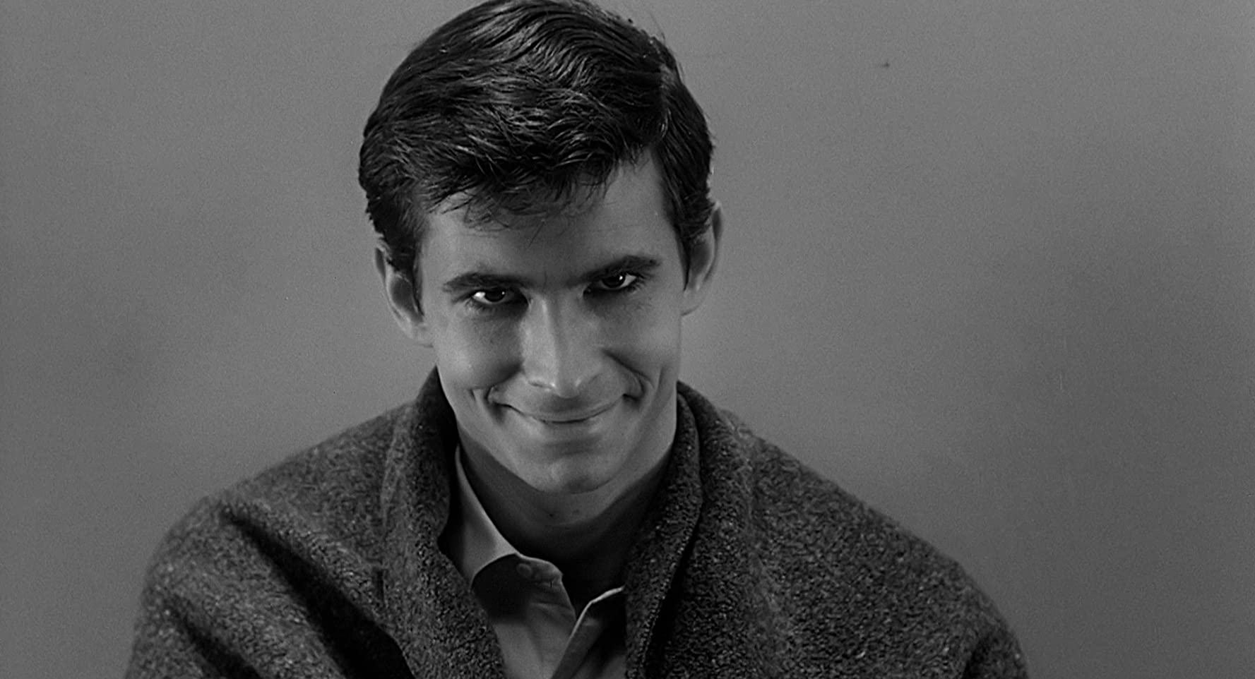 "Intergenerational Trauma:" Norman Bates (Anthony Perkins) stares into the camera with a menacing smile.