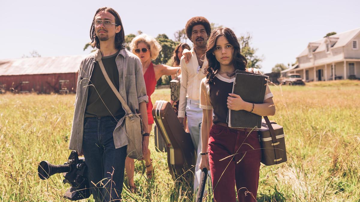 The cast of 'X' makes their way over to the guesthouse in the tall Texas grass. 