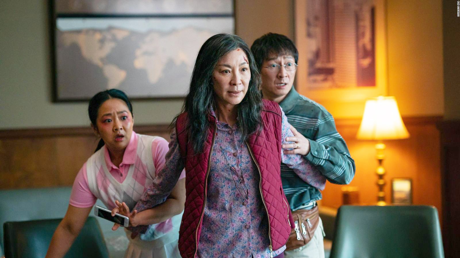 Michelle Yeoh as Evelyn Quan Wang defending Stephanie Hsu as Joy Wang and Ke Huy Quan as Wyamond Wang in Everything Everywhere All At Once (2022).