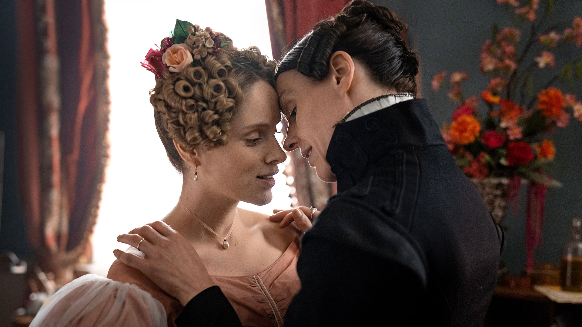 A frame from "Gentleman Jack" showing Marian Lister and Elizabeth Sutherland about to kiss. 