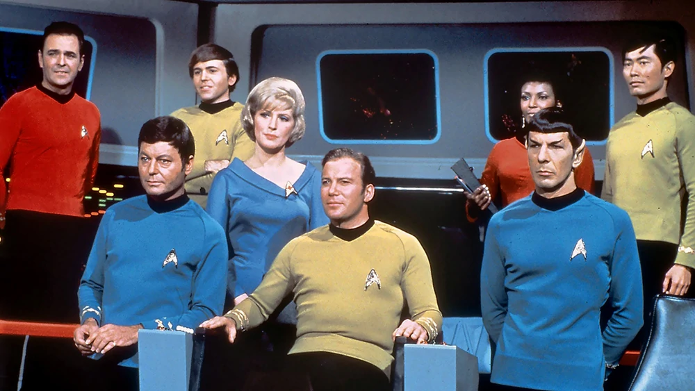 The crew of the Enterprise from Star Trek -TOS standing on deck. 