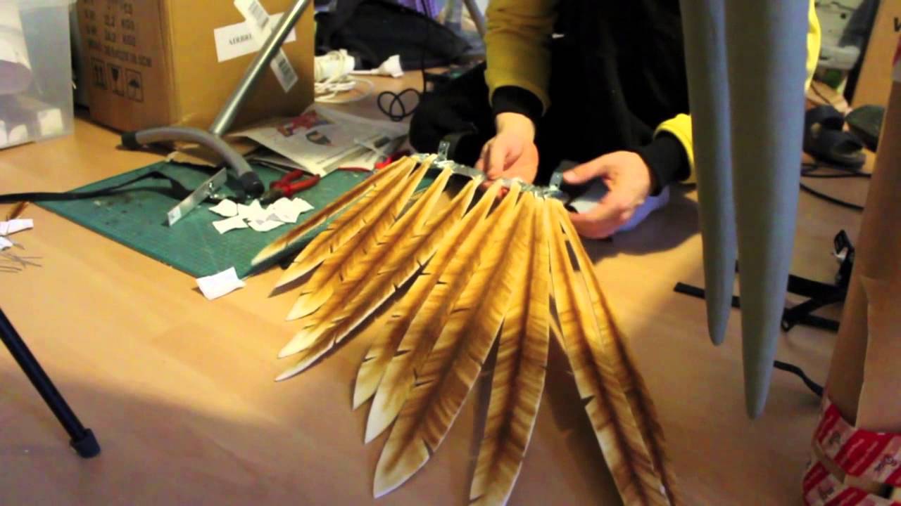 A person gluing feathers to a piece of metal for a cosplay. Blizzcon 2014 - Cosplay Making of. YouTube, uploaded by Lightning Cosplay. 19 Nov. 2014.