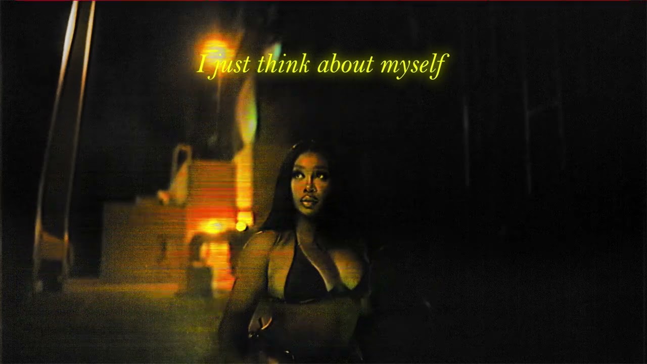 SZA looks up to the left (seemingly gazing at something offscreen). Above her, lyrics from "Ghost in the Machine" are displayed, reading, "I just think about myself."