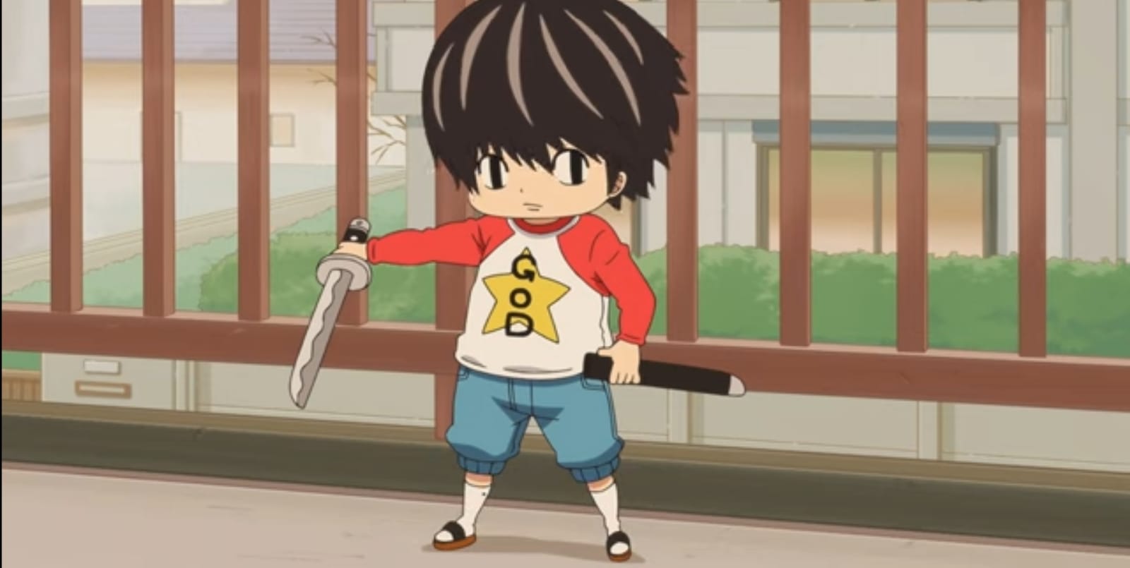 Young boy poses with toy sword wearing a red and white shirt with a yellow star. Episode 1. Mami Tsumura. Kotaro Lives Alone. LINDENFILMS. 2022.