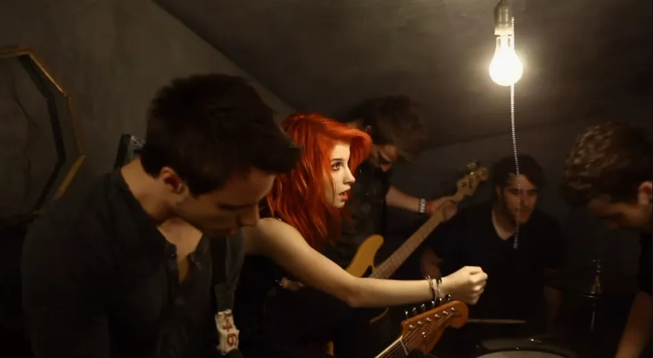 The members of Paramore crowd together in a small room as they perform "Ignorance." "Ignorance" Paramore. Fueled By Ramen. 2009.