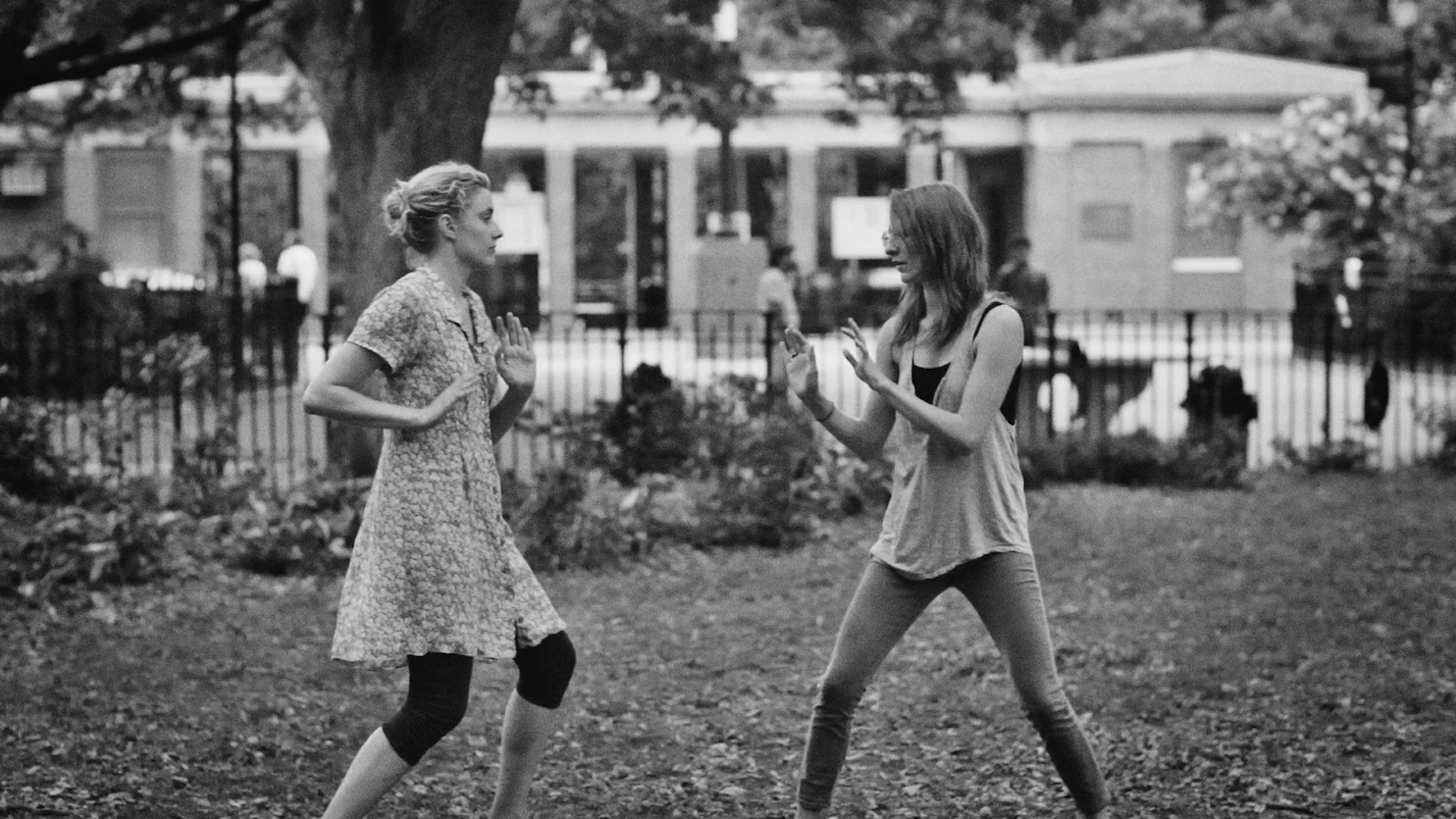 Frances (left) and Sophie (right) “play fighting” in Central Park. Baumbach, Noah, Dir. Frances Ha. 2012.